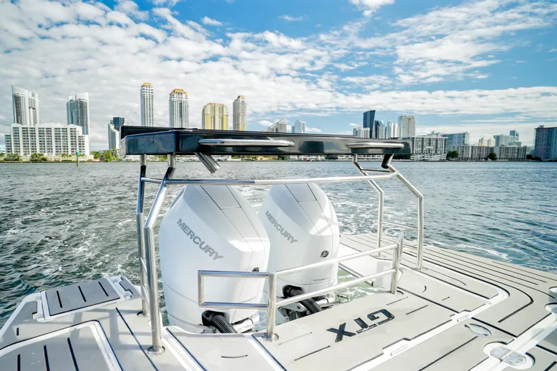  Yacht Photos Pics 2026 Granfort 37 boat with Mercury engines, city skyline in background.