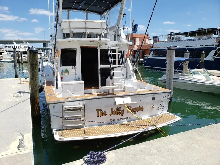 The Jolly Rogers Yacht Photos Pics 1987 Hi-Star Sportfish boat docked at marina, named The Jolly Roger, Fort Lauderdale, FL.