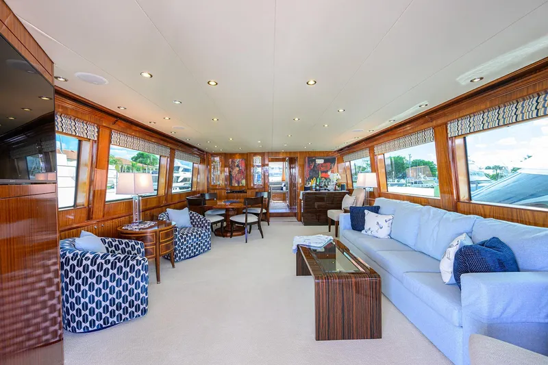 Sapphire Yacht Photos Pics Luxurious interior of 2009 Hatteras Enclosed Bridge yacht with elegant seating and wood finishes.