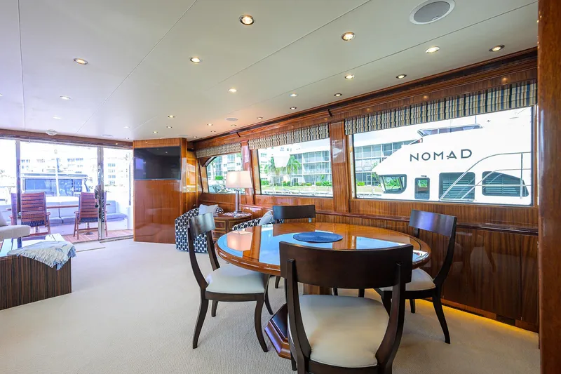 Sapphire Yacht Photos Pics Luxurious interior of 2009 Hatteras Enclosed Bridge yacht with elegant dining area.