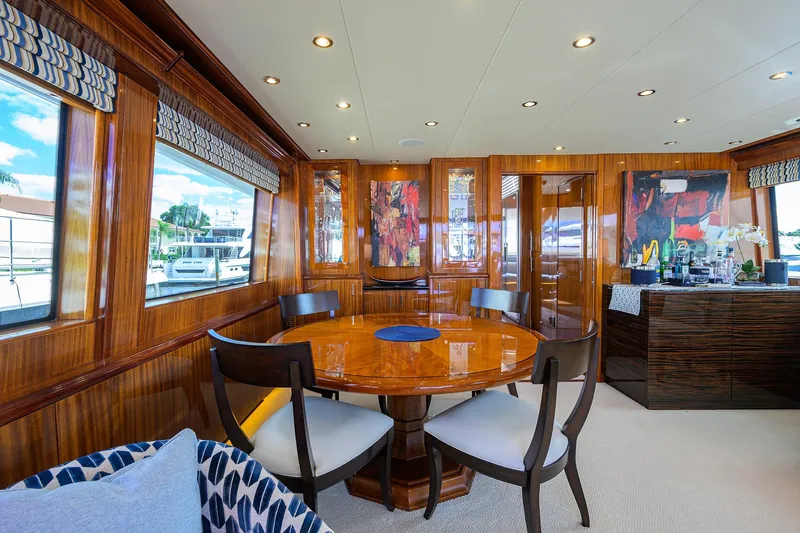 Sapphire Yacht Photos Pics Luxurious 2009 Hatteras Enclosed Bridge yacht interior with elegant dining area and modern decor.