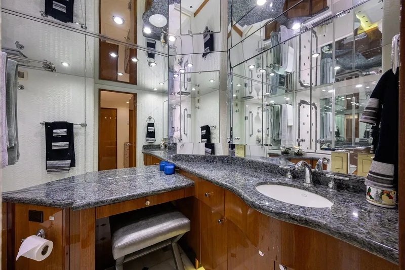 Sapphire Yacht Photos Pics Luxurious bathroom in 2009 Hatteras Enclosed Bridge yacht with granite countertops and mirrored walls.
