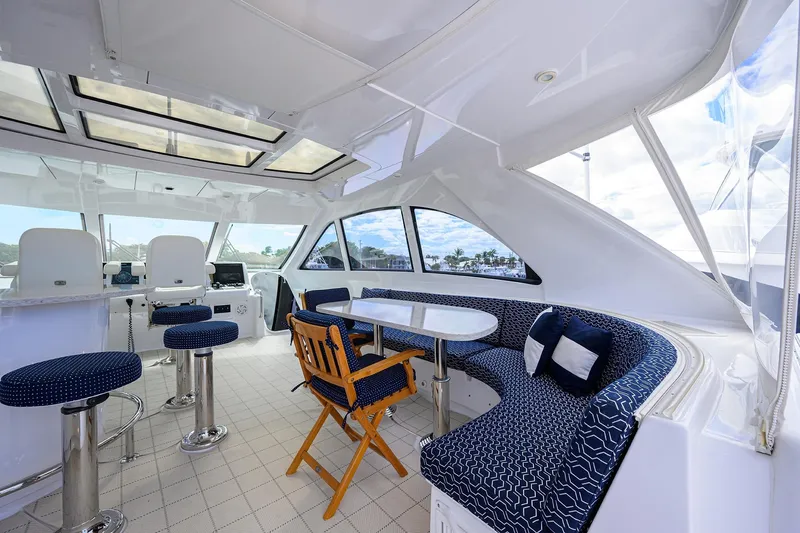 Sapphire Yacht Photos Pics Luxurious 2009 Hatteras Enclosed Bridge yacht interior with seating and navigation area.
