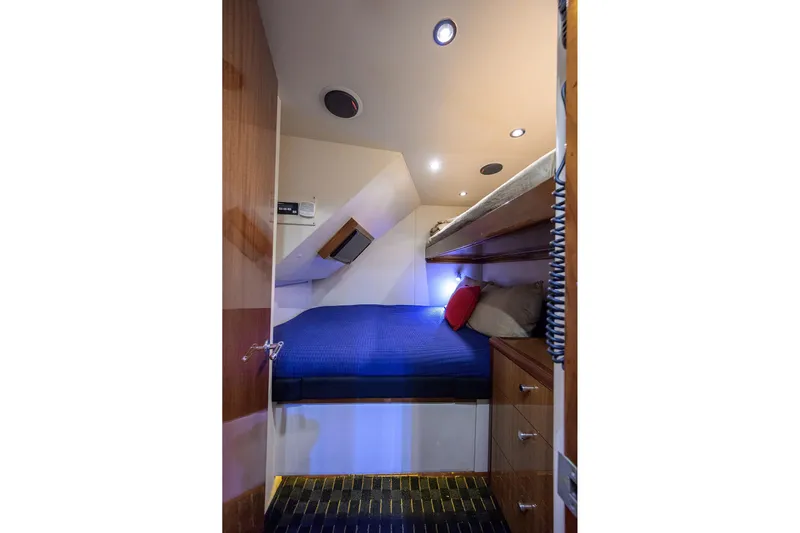 Sapphire Yacht Photos Pics 2009 Hatteras Enclosed Bridge cabin with bunk beds, wooden cabinetry, and modern lighting.