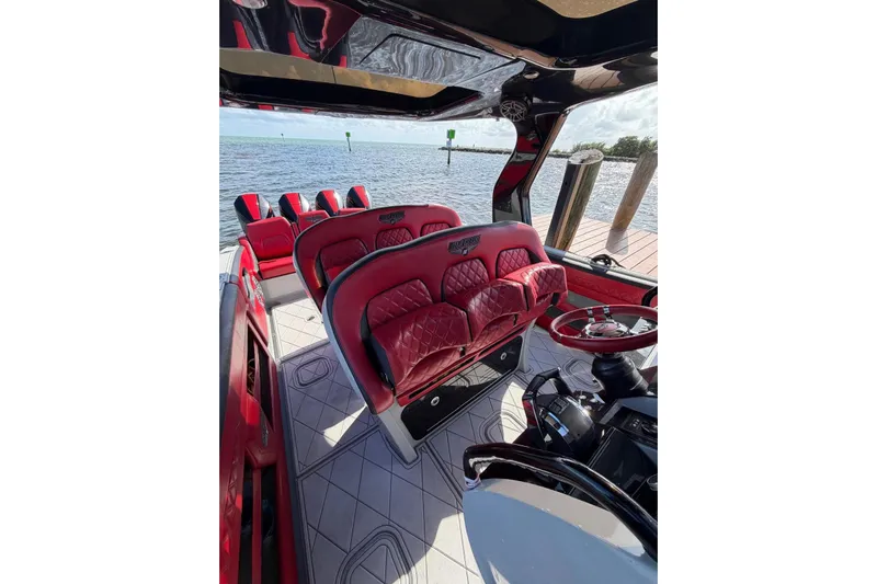  Yacht Photos Pics Luxurious interior of 2020 Deep Impact 399 Sport boat with red leather seating.