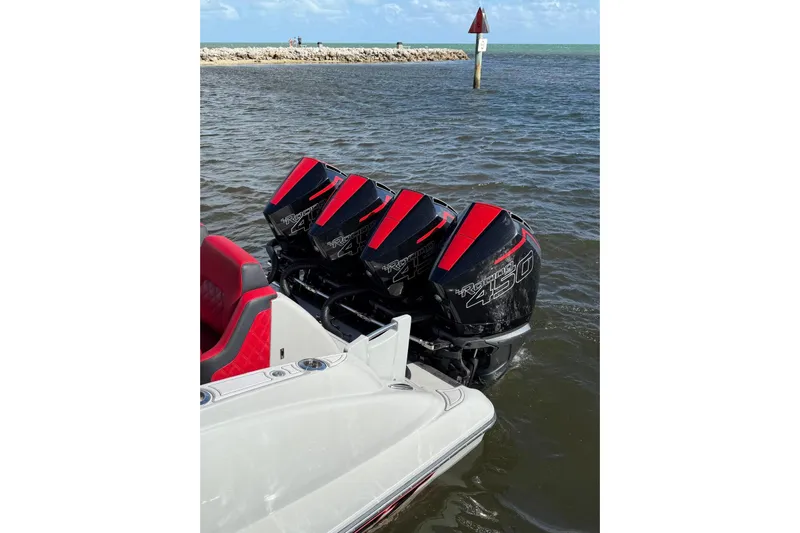  Yacht Photos Pics Four powerful outboard motors on a 2020 Deep Impact 399 Sport boat in the water.