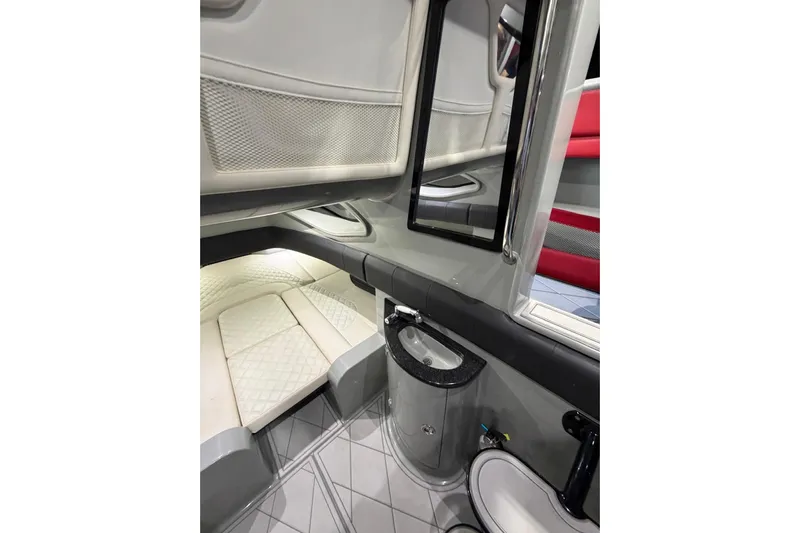  Yacht Photos Pics Interior of 2020 Deep Impact 399 Sport boat, featuring a compact cabin with a sink and seating.