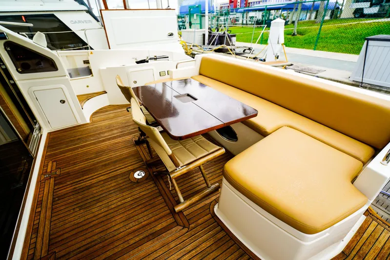  Yacht Photos Pics Luxurious 2012 Azimut Fly 53 yacht deck with elegant seating and wooden flooring.