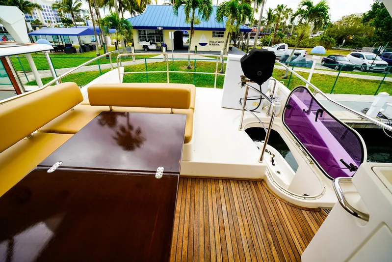  Yacht Photos Pics Luxurious 2012 Azimut Fly 53 yacht deck with seating and wooden flooring.
