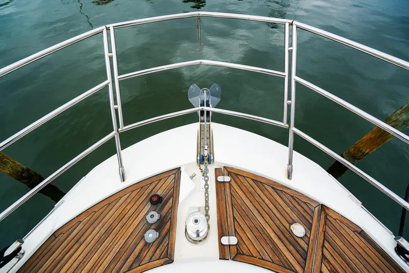  Yacht Photos Pics Bow of 2012 Azimut Fly 53 yacht with wooden deck and metal railings.