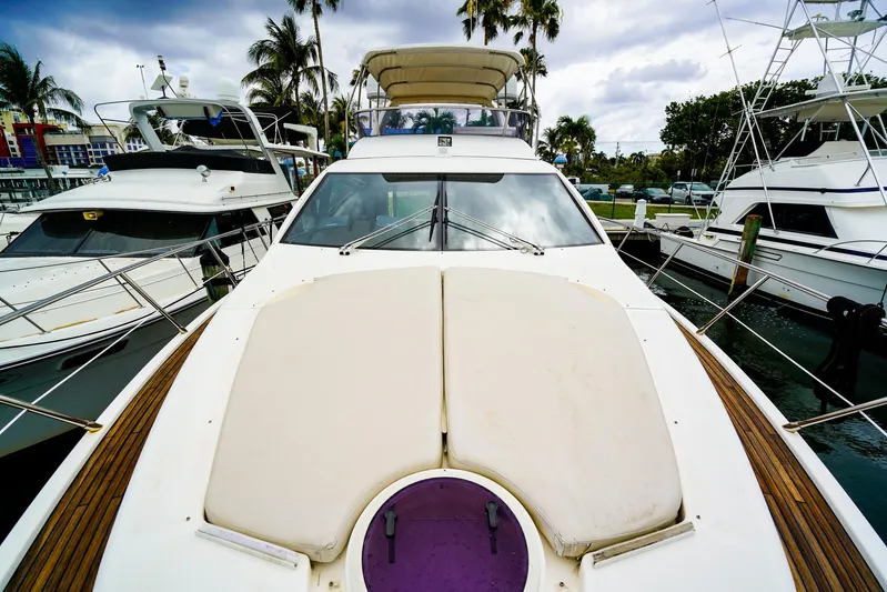  Yacht Photos Pics Azimut Fly 53 yacht, 2012 model, docked with palm trees in the background.