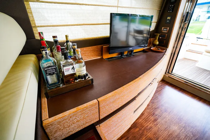  Yacht Photos Pics Luxurious interior of 2012 Azimut Fly 53 yacht with bar and TV setup.