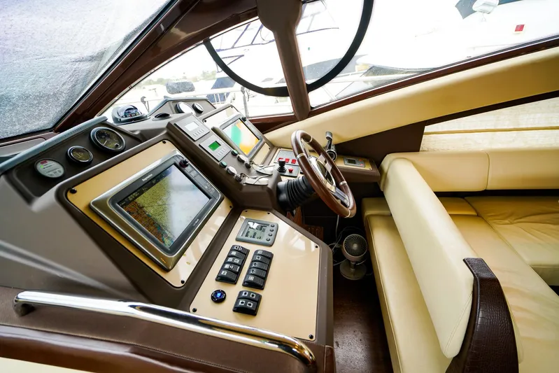  Yacht Photos Pics Luxurious 2012 Azimut Fly 53 yacht cockpit with advanced navigation controls and leather seating.