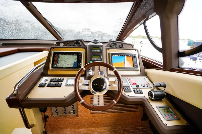  Yacht Photos Pics Cockpit of 2012 Azimut Fly 53 yacht with advanced navigation systems and steering wheel.