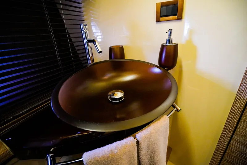  Yacht Photos Pics Luxurious bathroom sink on 2012 Azimut Fly 53 yacht, featuring modern fixtures and elegant design.