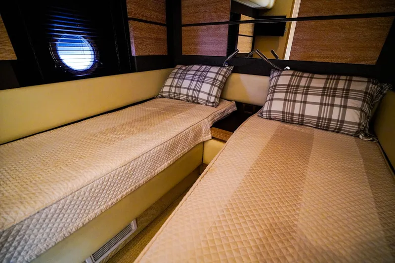  Yacht Photos Pics Interior cabin of 2012 Azimut Fly 53 yacht with twin beds and plaid pillows.