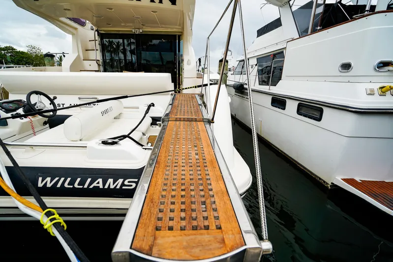  Yacht Photos Pics Azimut Fly 53 yacht, 2012 model, docked with wooden gangway and tender boat.