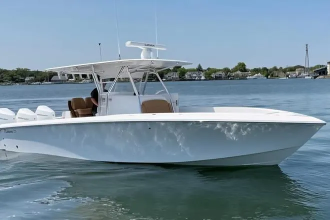  Yacht Photos Pics 2025 Bahama 35 boat on calm water, featuring sleek design and modern amenities.