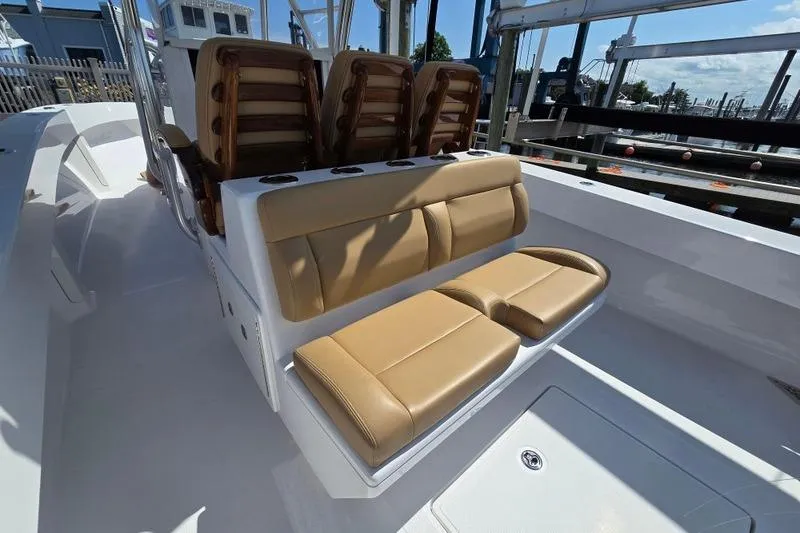  Yacht Photos Pics 2025 Bahama 35 boat with tan leather seating and sleek white deck design.