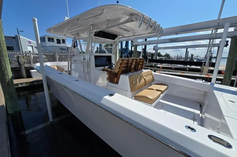  Yacht Photos Pics 2025 Bahama 35 boat docked, featuring sleek design and comfortable seating.