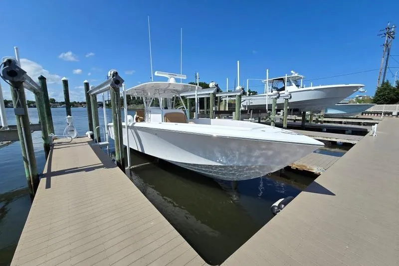  Yacht Photos Pics 2025 Bahama 35 boat docked at marina under clear blue sky.