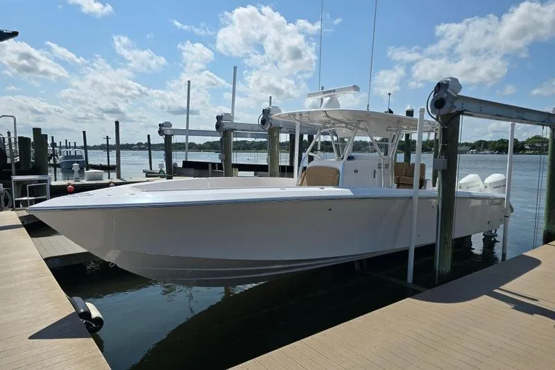  Yacht Photos Pics 2025 Bahama 35 boat docked under a clear blue sky.