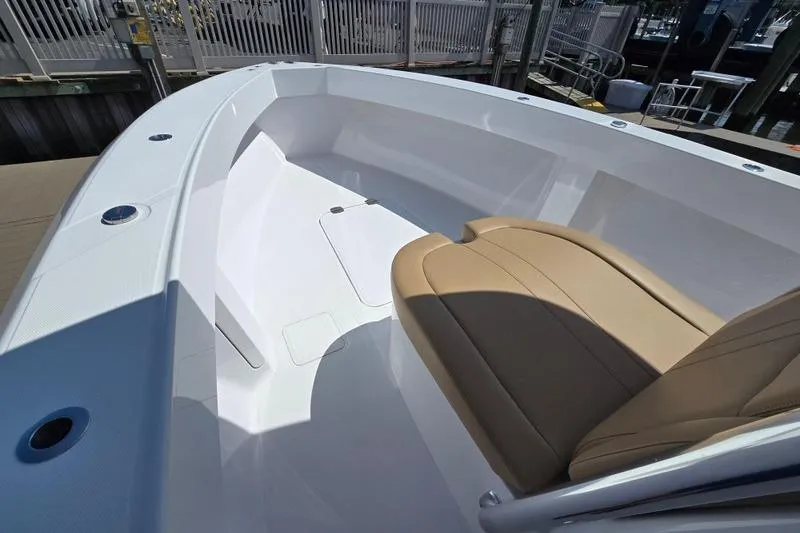  Yacht Photos Pics 2025 Bahama 35 boat interior with tan seating and sleek white design.