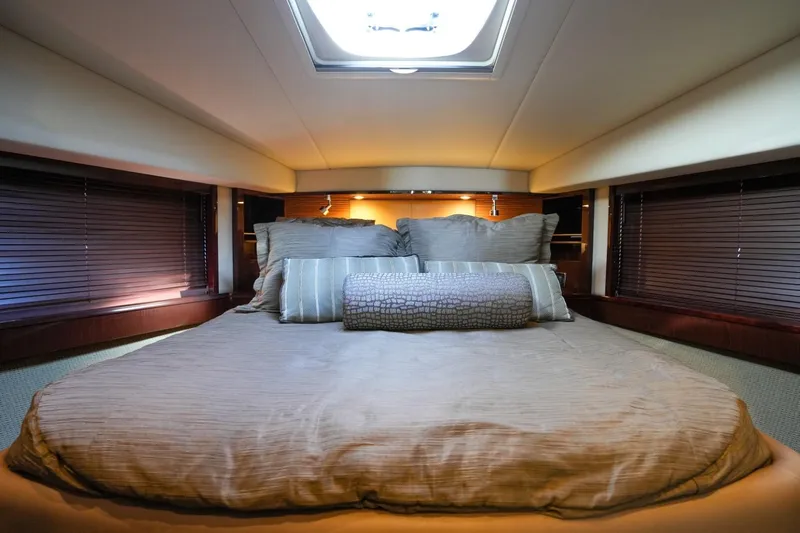 Victoria Yacht Photos Pics Luxurious bedroom interior of 2013 Sea Ray 610 Sundancer yacht with plush bedding.