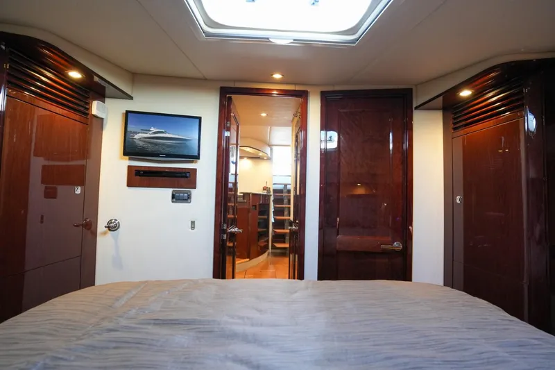 Victoria Yacht Photos Pics Luxurious interior of 2013 Sea Ray 610 Sundancer yacht cabin with wood finishes.