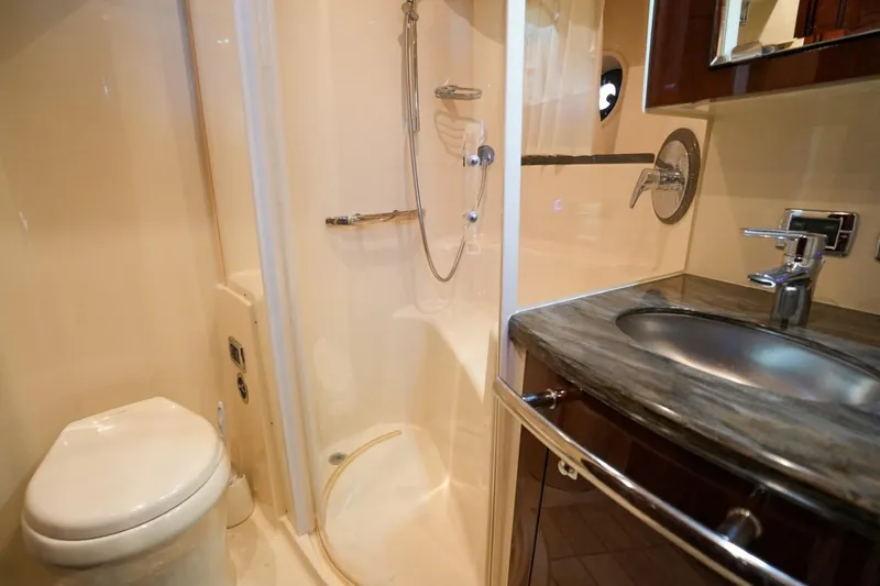 Victoria Yacht Photos Pics Luxurious bathroom in 2013 Sea Ray 610 Sundancer yacht with shower, sink, and toilet.