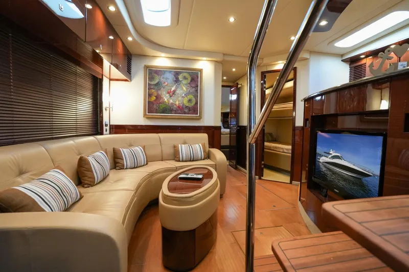 Victoria Yacht Photos Pics Luxurious interior of 2013 Sea Ray 610 Sundancer yacht with plush seating and modern decor.