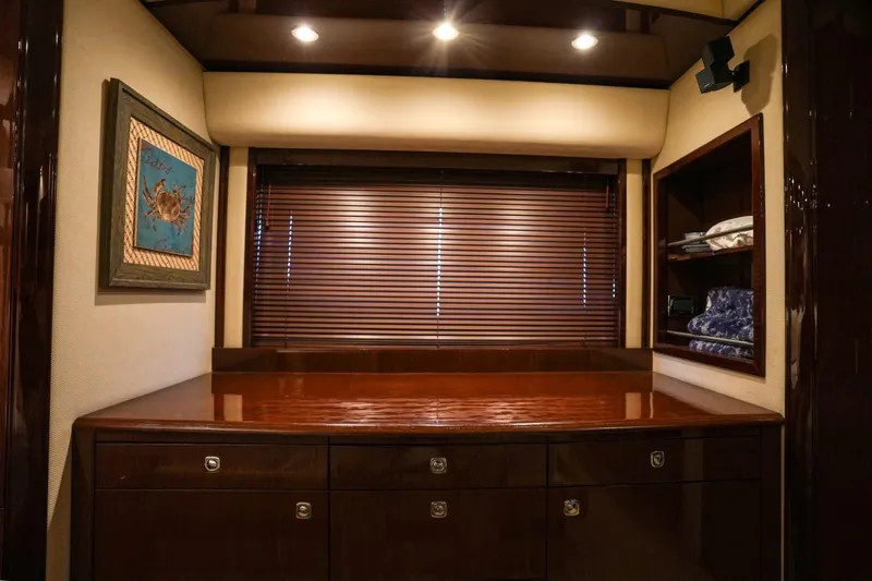 Victoria Yacht Photos Pics Luxurious interior of 2013 Sea Ray 610 Sundancer yacht with wooden cabinetry and artwork.