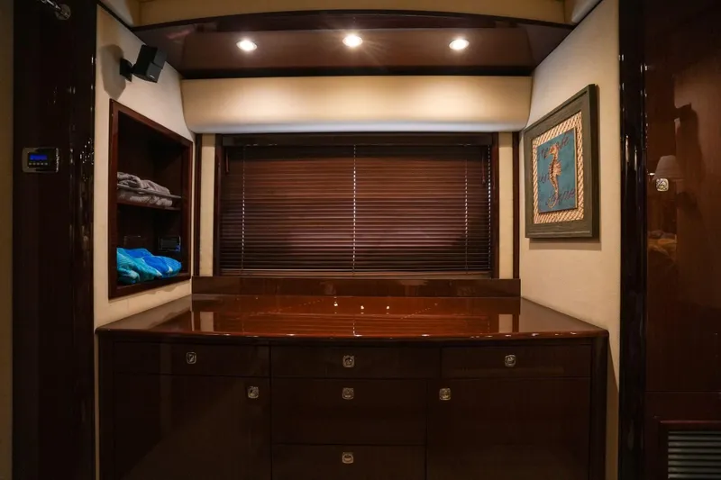 Victoria Yacht Photos Pics Luxurious interior of 2013 Sea Ray 610 Sundancer yacht with elegant wood cabinetry and ambient lighting.