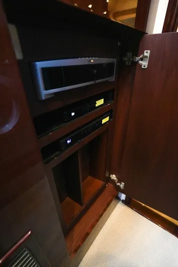 Victoria Yacht Photos Pics 2013 Sea Ray 610 Sundancer interior cabinet with electronic equipment.