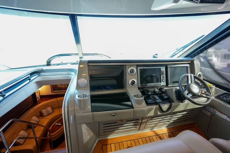 Victoria Yacht Photos Pics 2013 Sea Ray 610 Sundancer helm with modern navigation equipment and luxurious interior.