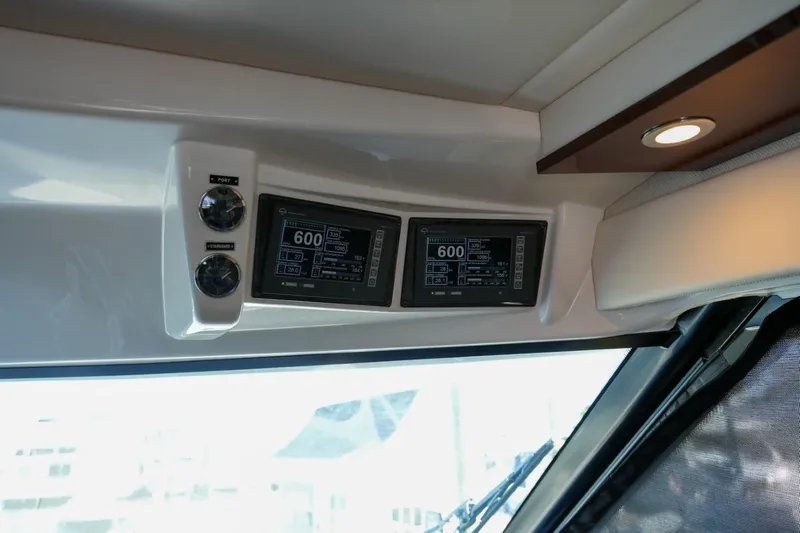 Victoria Yacht Photos Pics 2013 Sea Ray 610 Sundancer dashboard with dual display screens and controls.