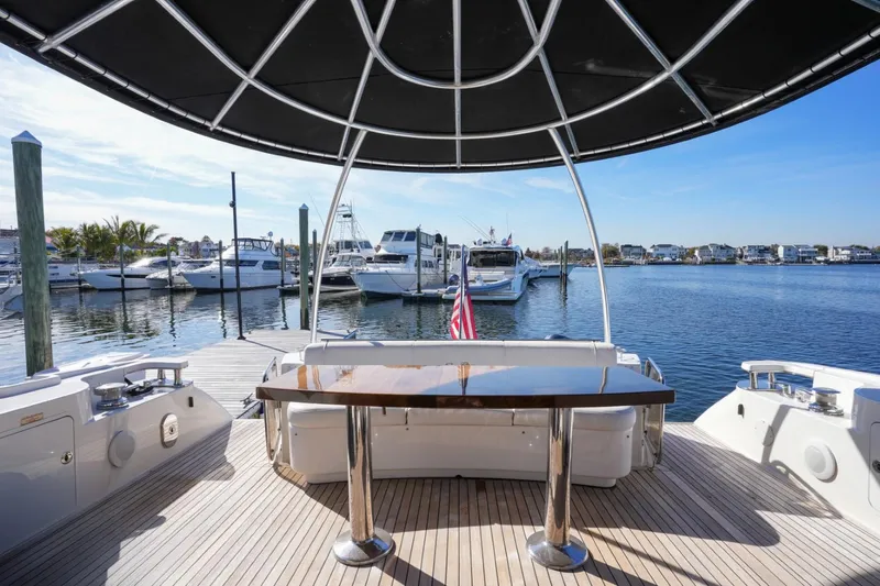 Victoria Yacht Photos Pics 2013 Sea Ray 610 Sundancer yacht docked at marina, featuring spacious deck and elegant design.