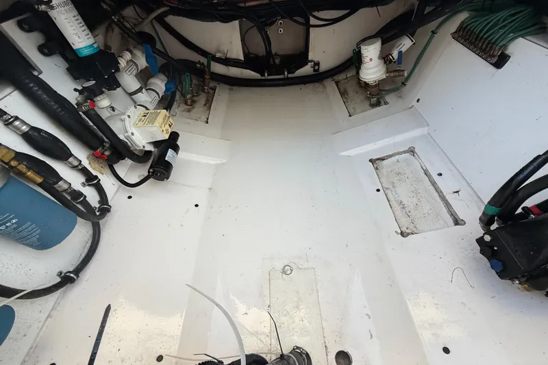 On Pointe Yacht Photos Pics 2016 Pursuit DC 325 Dual Console engine compartment with visible wiring and components.