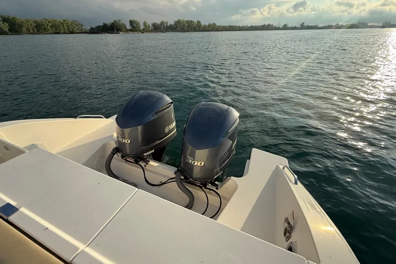 On Pointe Yacht Photos Pics 2016 Pursuit DC 325 Dual Console with twin Yamaha engines on calm water.