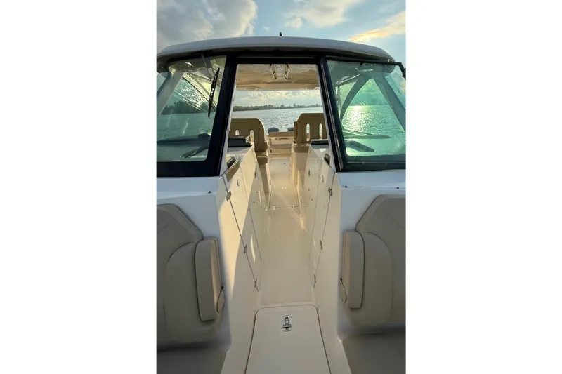 On Pointe Yacht Photos Pics 2016 Pursuit DC 325 Dual Console boat interior with scenic water view.