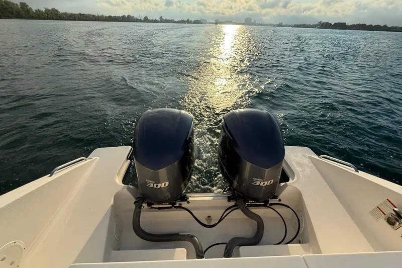 On Pointe Yacht Photos Pics 2016 Pursuit DC 325 Dual Console boat with twin Yamaha 300 engines on open water.