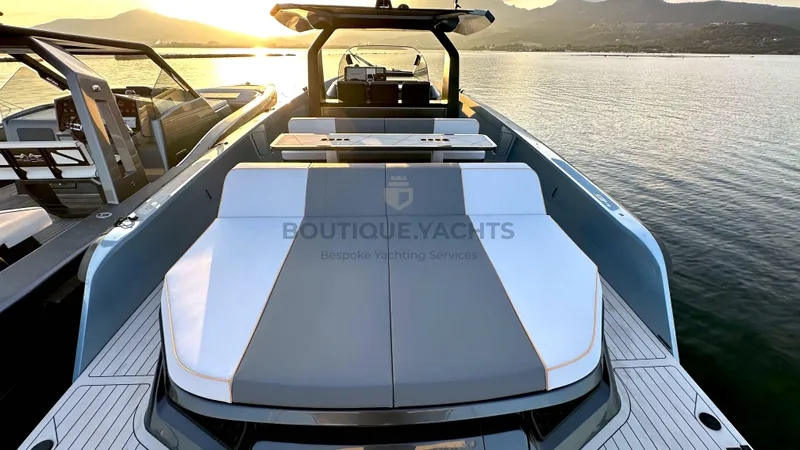 Hull #5 Yacht Photos Pics Luxurious 2024 Maori 46ft yacht at sunset, featuring sleek design and spacious deck.