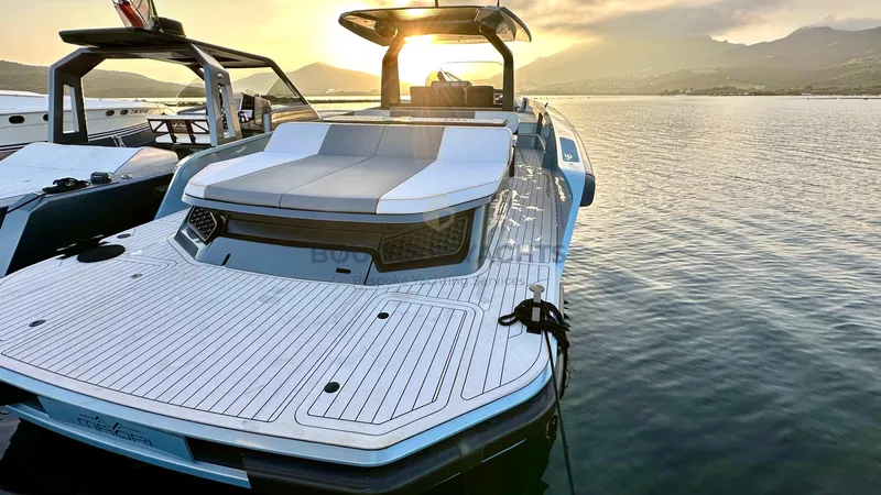 Hull #5 Yacht Photos Pics 2024 Maori 46ft yacht at sunset, docked on calm water.