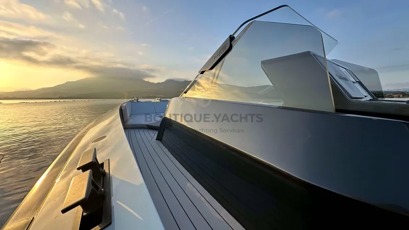 Hull #5 Yacht Photos Pics 2024 Maori 46ft yacht at sunset, sleek design, calm waters.