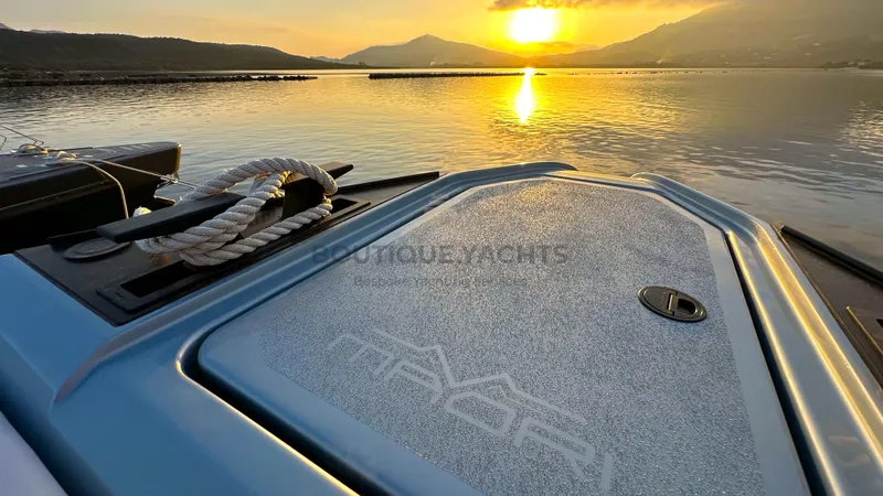 Hull #5 Yacht Photos Pics 2024 Maori 46ft yacht at sunset on tranquil water.