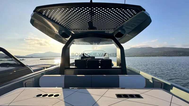 Hull #5 Yacht Photos Pics Luxurious 2024 Maori 46ft yacht with modern design, cruising on serene waters at sunset.