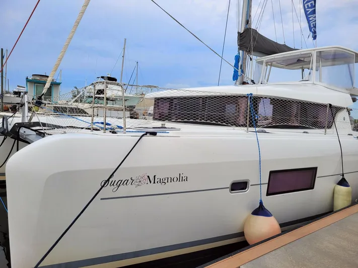Sugar Magnolia Yacht Photos Pics 2017 Lagoon 42 catamaran docked at marina, named Sugar Magnolia.