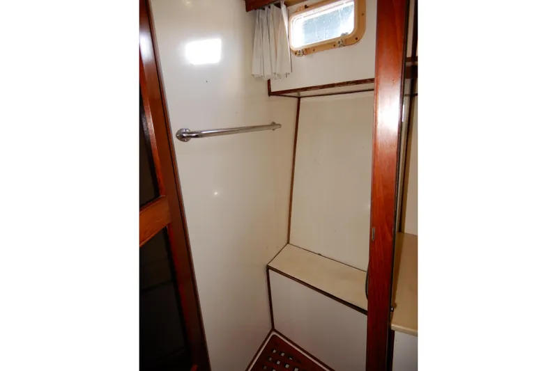  Yacht Photos Pics 1989 Jefferson 46 Sundeck interior shower area with wooden accents and small window.