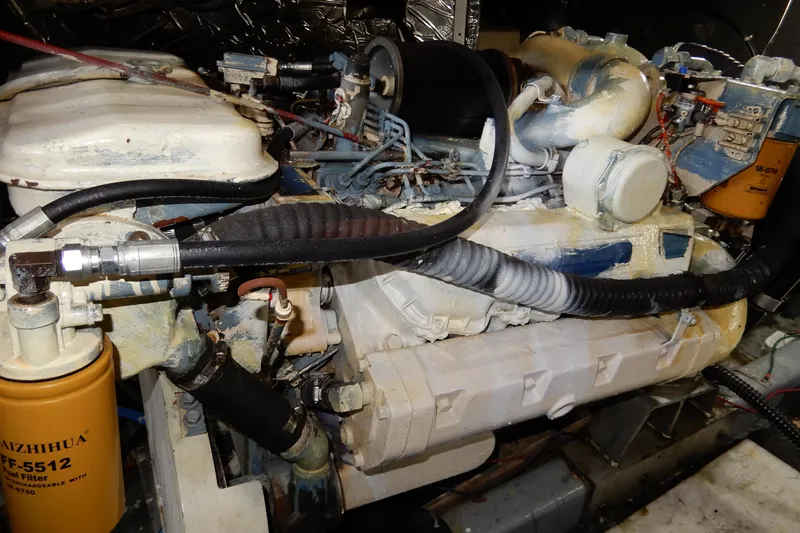  Yacht Photos Pics Engine compartment of a 1989 Jefferson 46 Sundeck boat, showing detailed mechanical components.