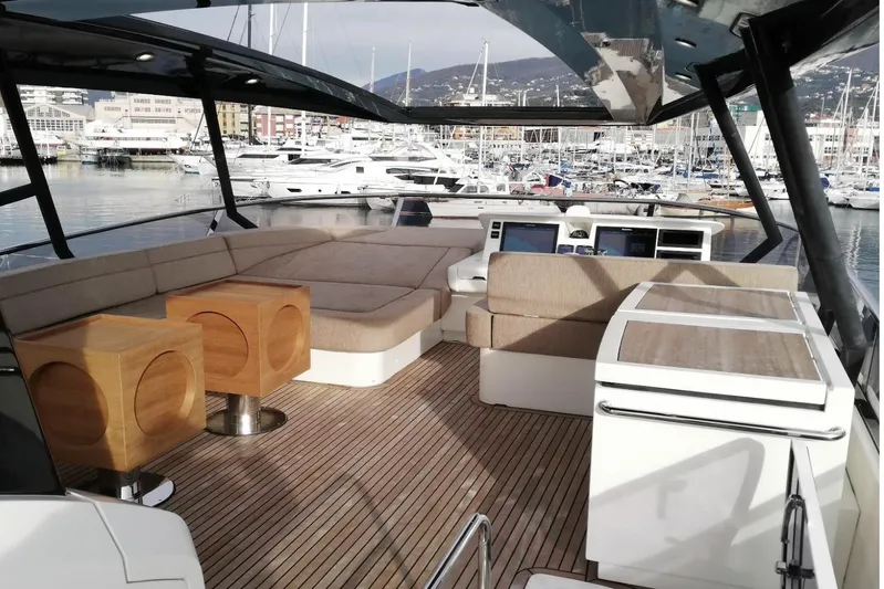 Tyche Yacht Photos Pics Luxurious 2019 Monte Carlo Yachts MCY 76 interior with elegant seating and modern design.